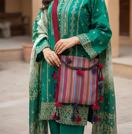 a green dressed pakistani model having this handmade bag on shoulder. Showing the beauty of this bag
